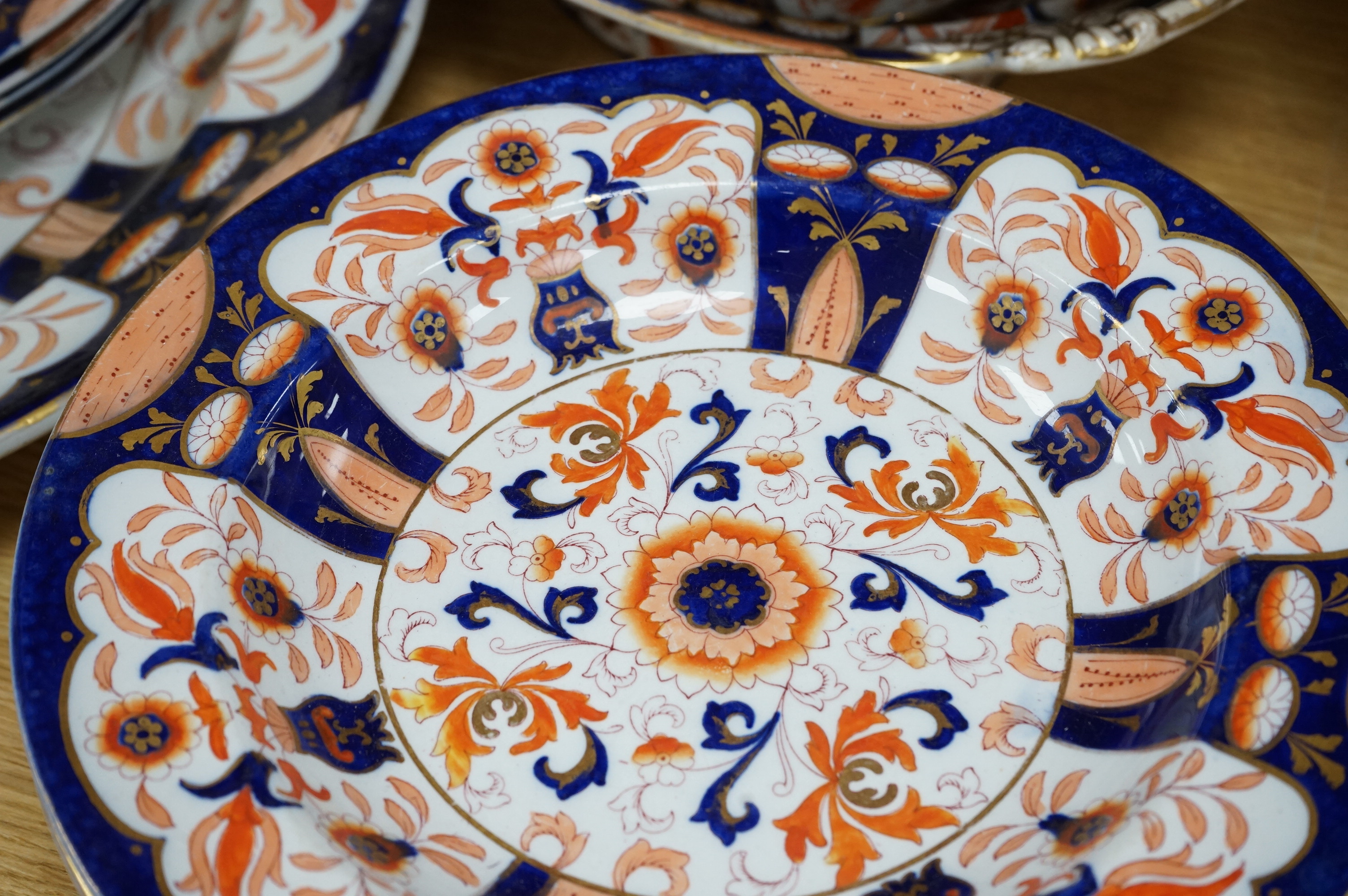 Fifteen items of a mid 19th century Mason's/Ashworth’s ironstone dinner service. Oval meat platter 48.5cm wide. Condition - three plates chipped, some losses to gilding